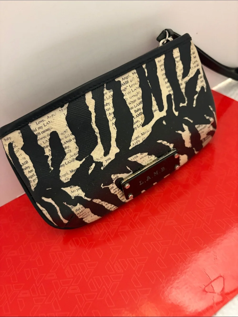 L.A.M.B. Black and Cream Zebra-Print Clutch with Logo Plate